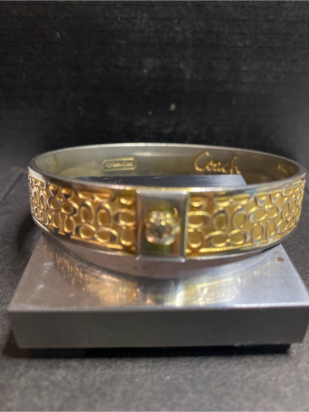 Coach Gold-Tone Signature Pattern Bangle Bracelet